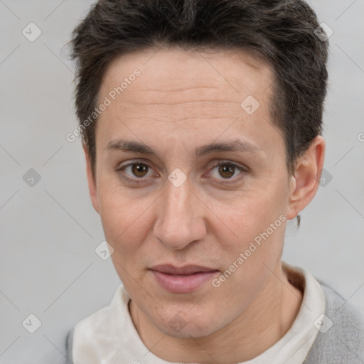 Joyful white adult female with short  brown hair and brown eyes