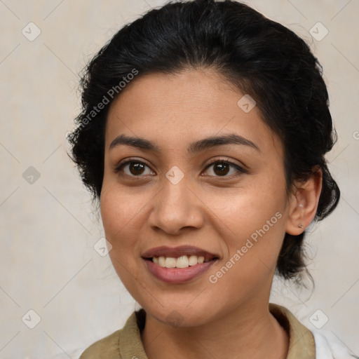 Joyful latino young-adult female with medium  brown hair and brown eyes