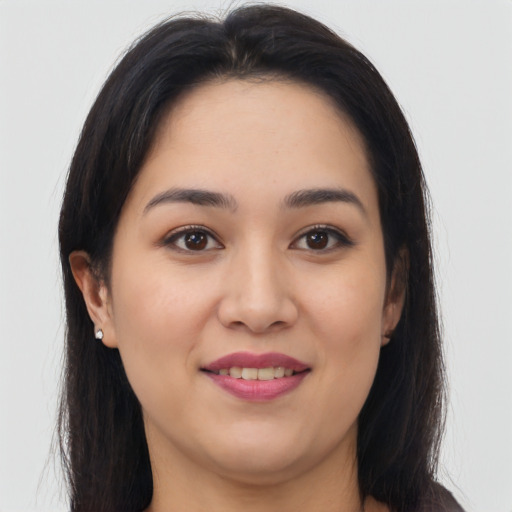 Joyful asian young-adult female with long  brown hair and brown eyes