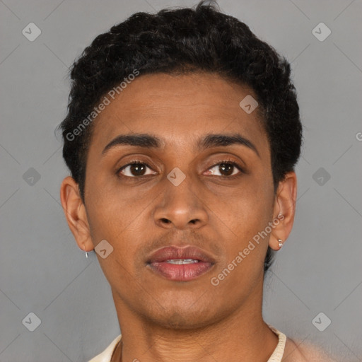 Joyful latino young-adult male with short  brown hair and brown eyes