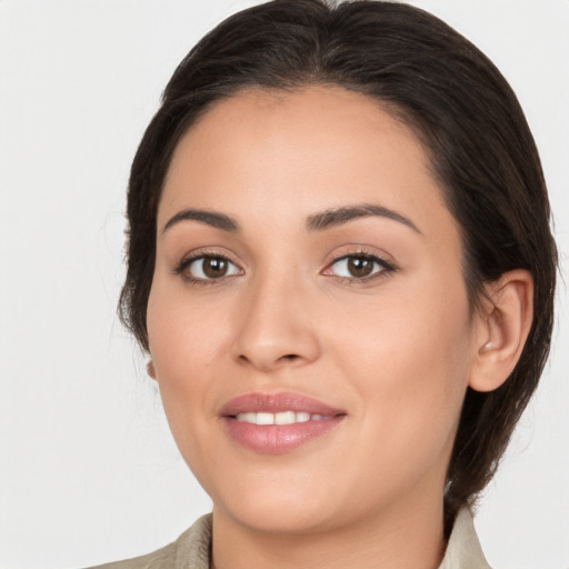 Joyful white young-adult female with medium  brown hair and brown eyes