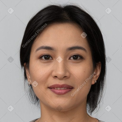 Joyful asian young-adult female with medium  brown hair and brown eyes