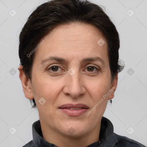 Joyful white adult female with short  brown hair and brown eyes