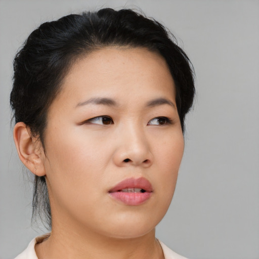 Neutral asian young-adult female with short  black hair and brown eyes