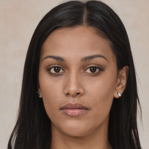 Joyful asian young-adult female with long  brown hair and brown eyes