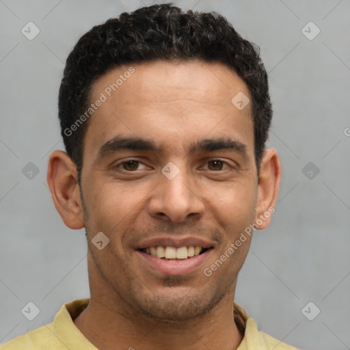Joyful latino young-adult male with short  brown hair and brown eyes