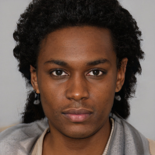 Neutral black young-adult female with short  black hair and brown eyes