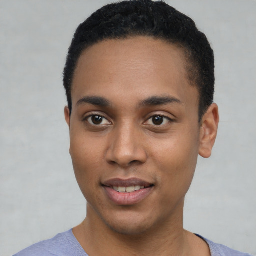 Joyful black young-adult male with short  black hair and brown eyes