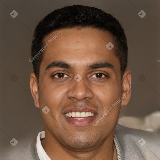 Joyful black young-adult male with short  brown hair and brown eyes