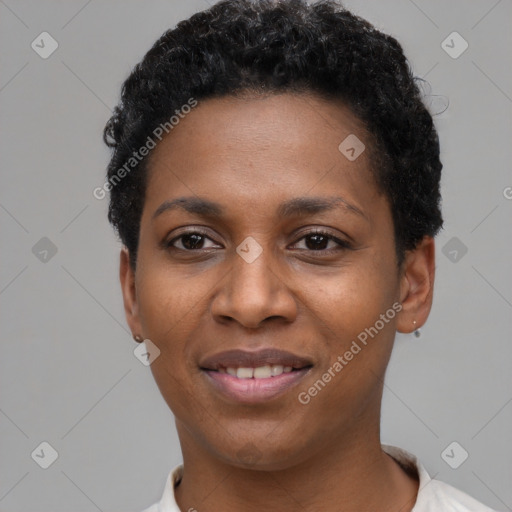 Joyful black young-adult female with short  black hair and brown eyes