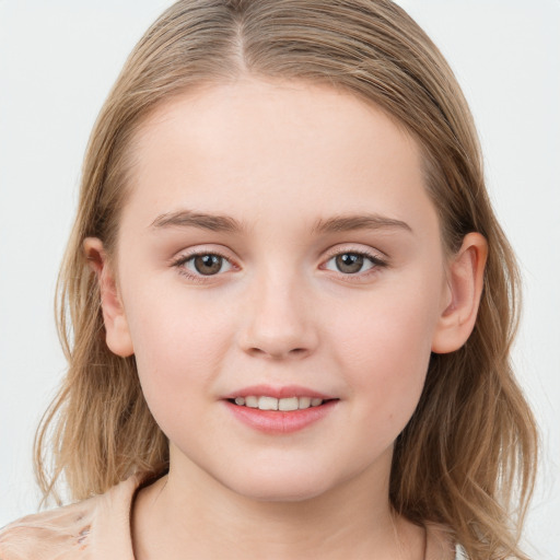 Joyful white child female with medium  brown hair and grey eyes