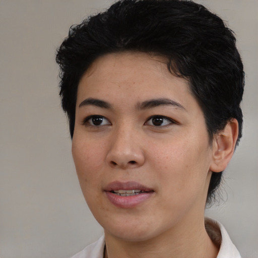Joyful white young-adult female with short  black hair and brown eyes