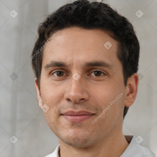 Joyful white adult male with short  brown hair and brown eyes