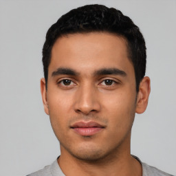 Neutral latino young-adult male with short  black hair and brown eyes