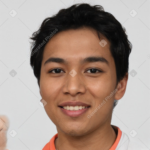 Joyful latino young-adult male with short  black hair and brown eyes