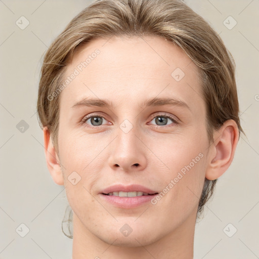 Joyful white young-adult female with medium  brown hair and blue eyes