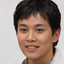 Joyful asian young-adult female with short  brown hair and brown eyes