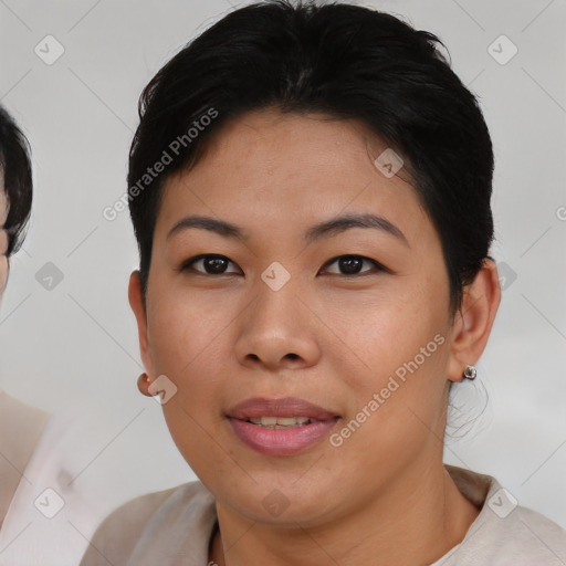 Joyful asian young-adult female with short  brown hair and brown eyes