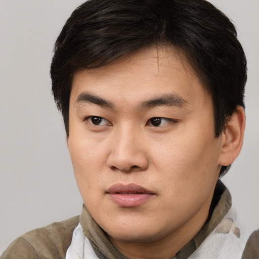 Neutral asian young-adult male with short  brown hair and brown eyes