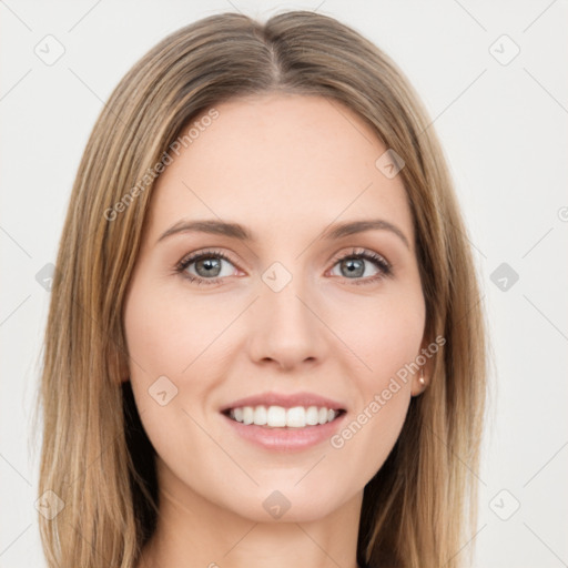 Joyful white young-adult female with long  brown hair and green eyes