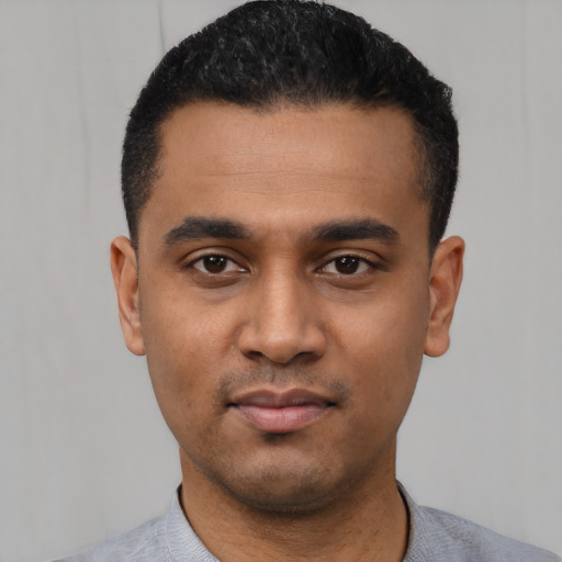 Neutral latino young-adult male with short  black hair and brown eyes