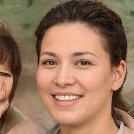 Joyful white young-adult female with medium  brown hair and brown eyes