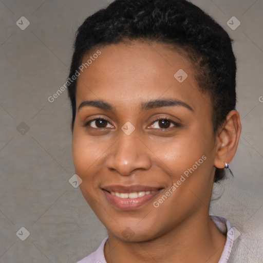 Joyful black young-adult female with short  brown hair and brown eyes