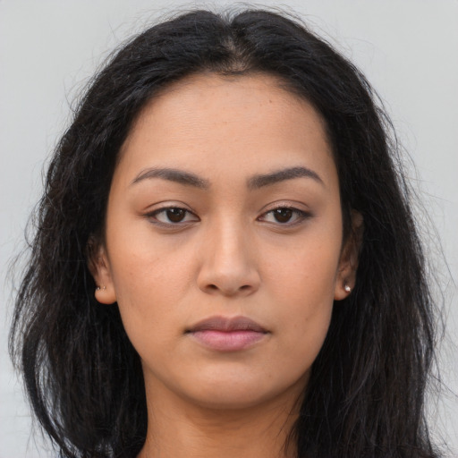 Neutral latino young-adult female with long  black hair and brown eyes