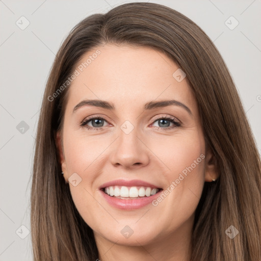 Joyful white young-adult female with long  brown hair and grey eyes