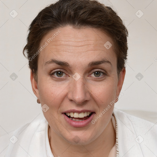 Joyful white adult female with short  brown hair and brown eyes