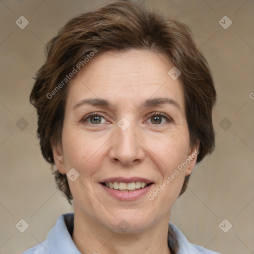 Joyful white adult female with short  brown hair and grey eyes