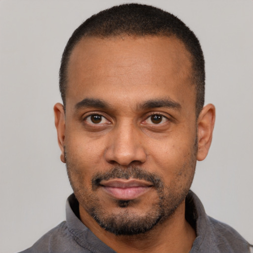Neutral latino adult male with short  black hair and brown eyes