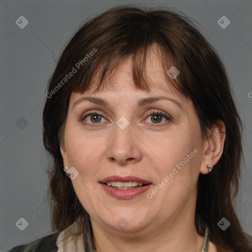 Joyful white adult female with medium  brown hair and brown eyes