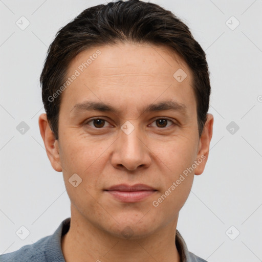 Joyful white adult male with short  brown hair and brown eyes