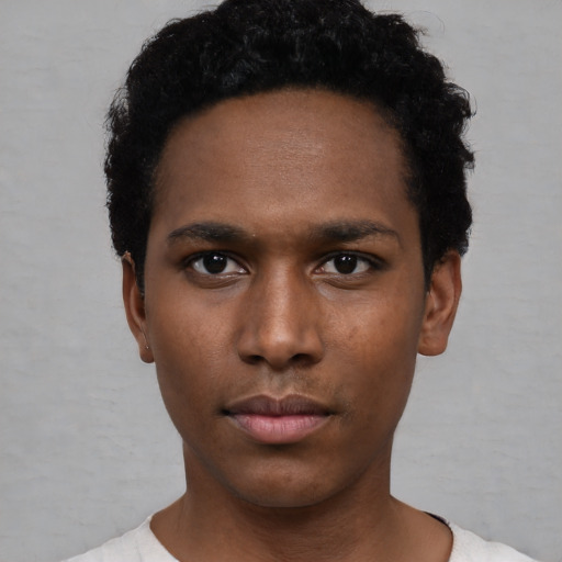 Neutral black young-adult male with short  black hair and brown eyes