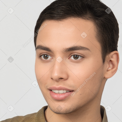 Joyful white young-adult male with short  brown hair and brown eyes