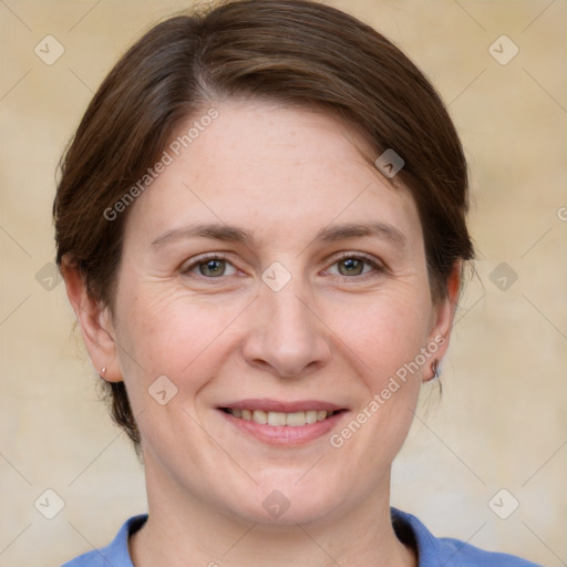 Joyful white adult female with medium  brown hair and grey eyes