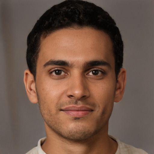 Neutral latino young-adult male with short  brown hair and brown eyes
