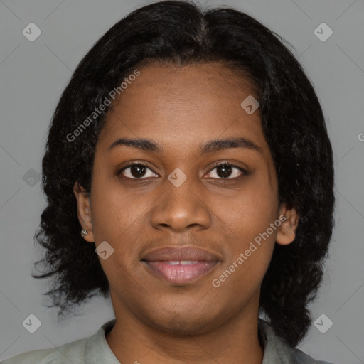 Joyful black young-adult female with medium  black hair and brown eyes