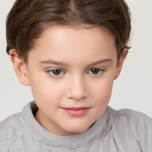 Joyful white child female with short  brown hair and brown eyes