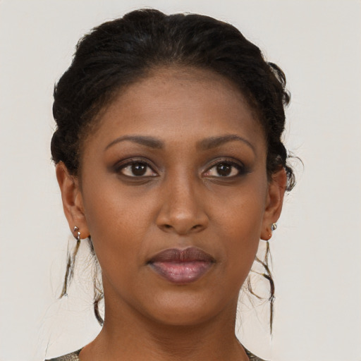 Neutral black young-adult female with long  brown hair and brown eyes