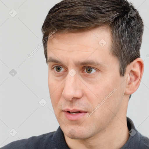 Joyful white adult male with short  brown hair and brown eyes