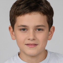 Joyful white child male with short  brown hair and brown eyes