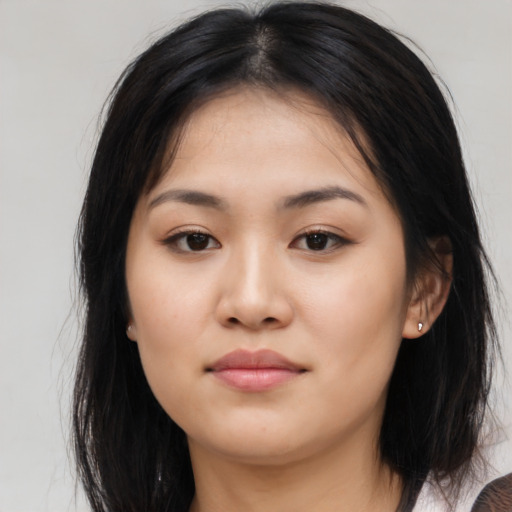 Neutral asian young-adult female with medium  brown hair and brown eyes