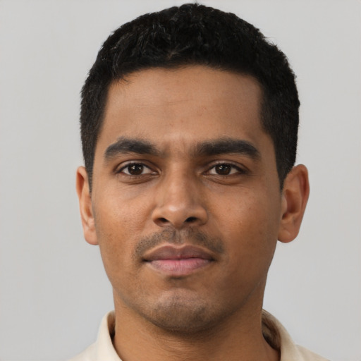 Neutral latino young-adult male with short  black hair and brown eyes