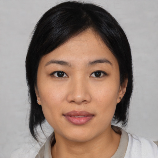 Neutral asian young-adult female with medium  black hair and brown eyes