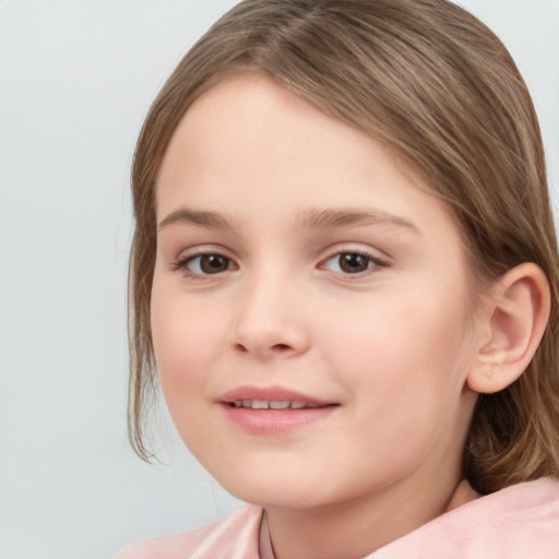 Joyful white child female with medium  brown hair and brown eyes