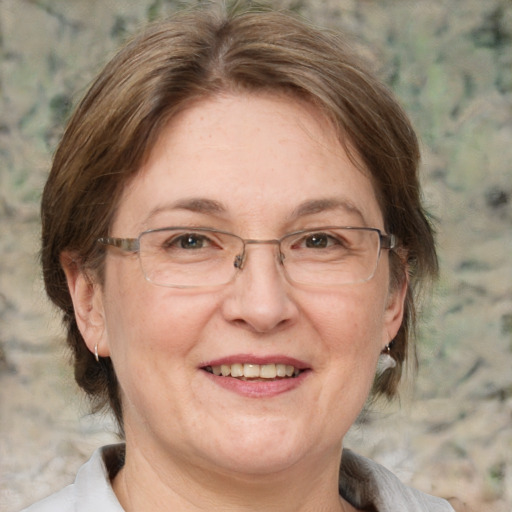 Joyful white middle-aged female with medium  brown hair and grey eyes