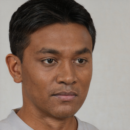 Neutral asian young-adult male with short  brown hair and brown eyes