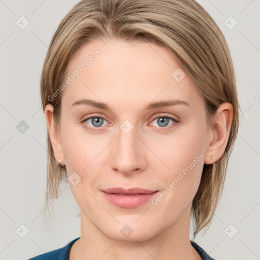 Joyful white young-adult female with medium  brown hair and blue eyes